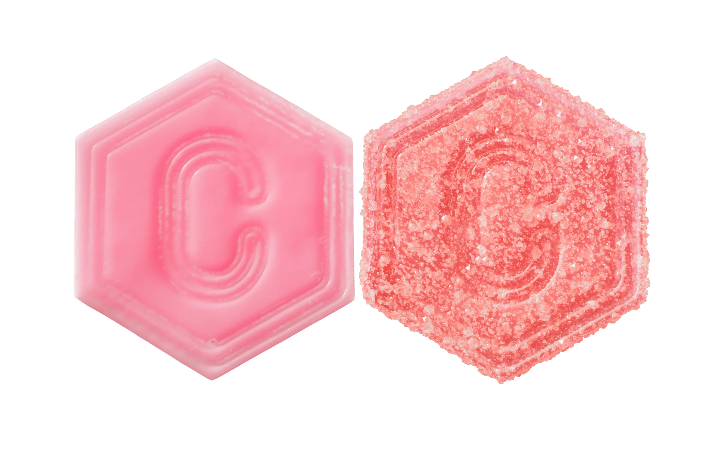 Two hexagon gummies, one pink and one covered in sugar